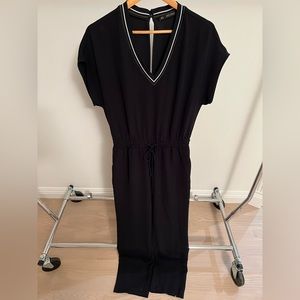 Zara Jumpsuit with pockets and drawstring waist. Side stripe/v-neck detailing.